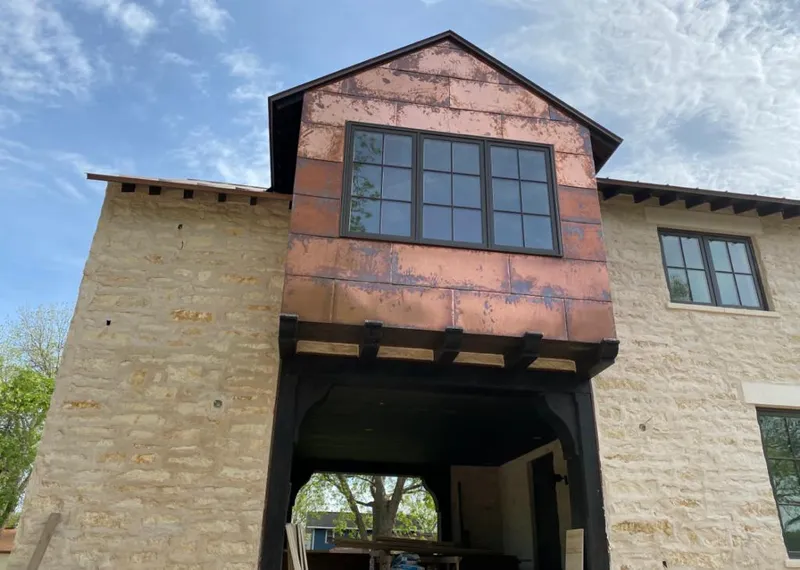 Copper metal panel facade on a stone building for Roof Repair in North Lebanon